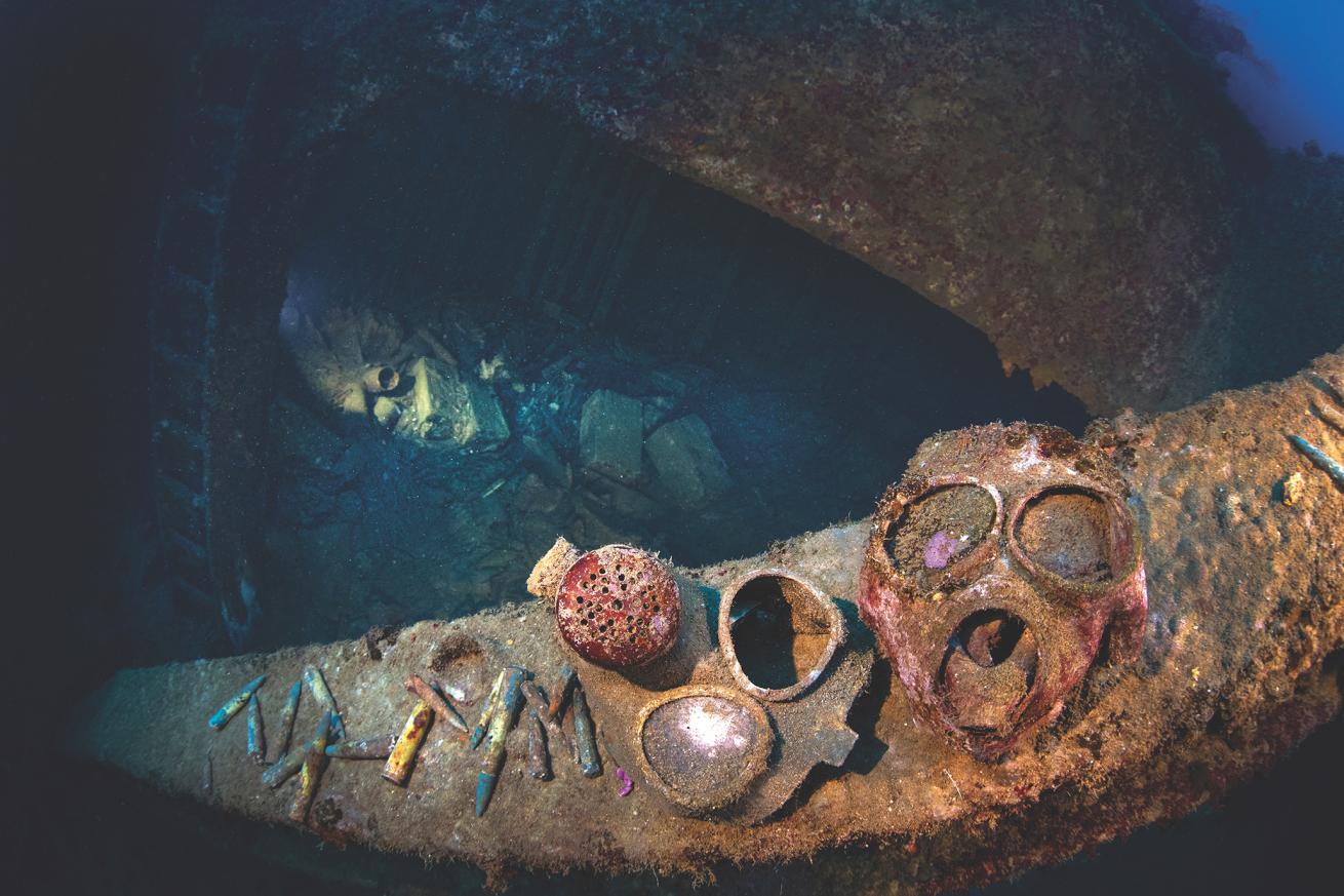 A gas mask overlooks a cargo hold on the Nippo Maru wreck.