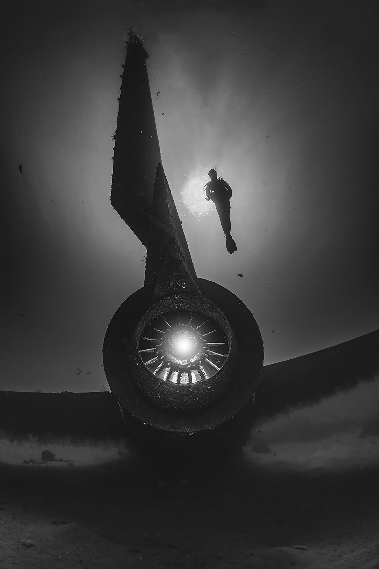 A diver swims above the TriStar wreck in Aqaba Jordan