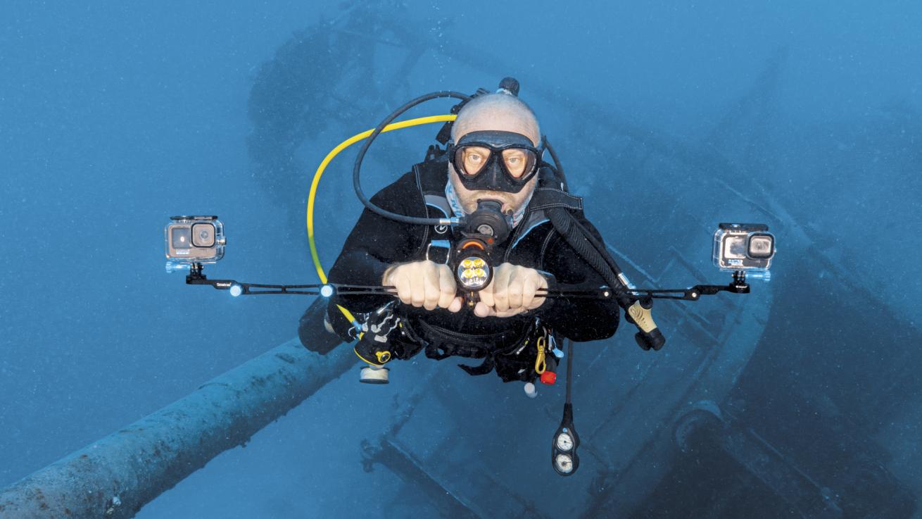 a scuba diver uses two gopros to map the kittiwake wreck