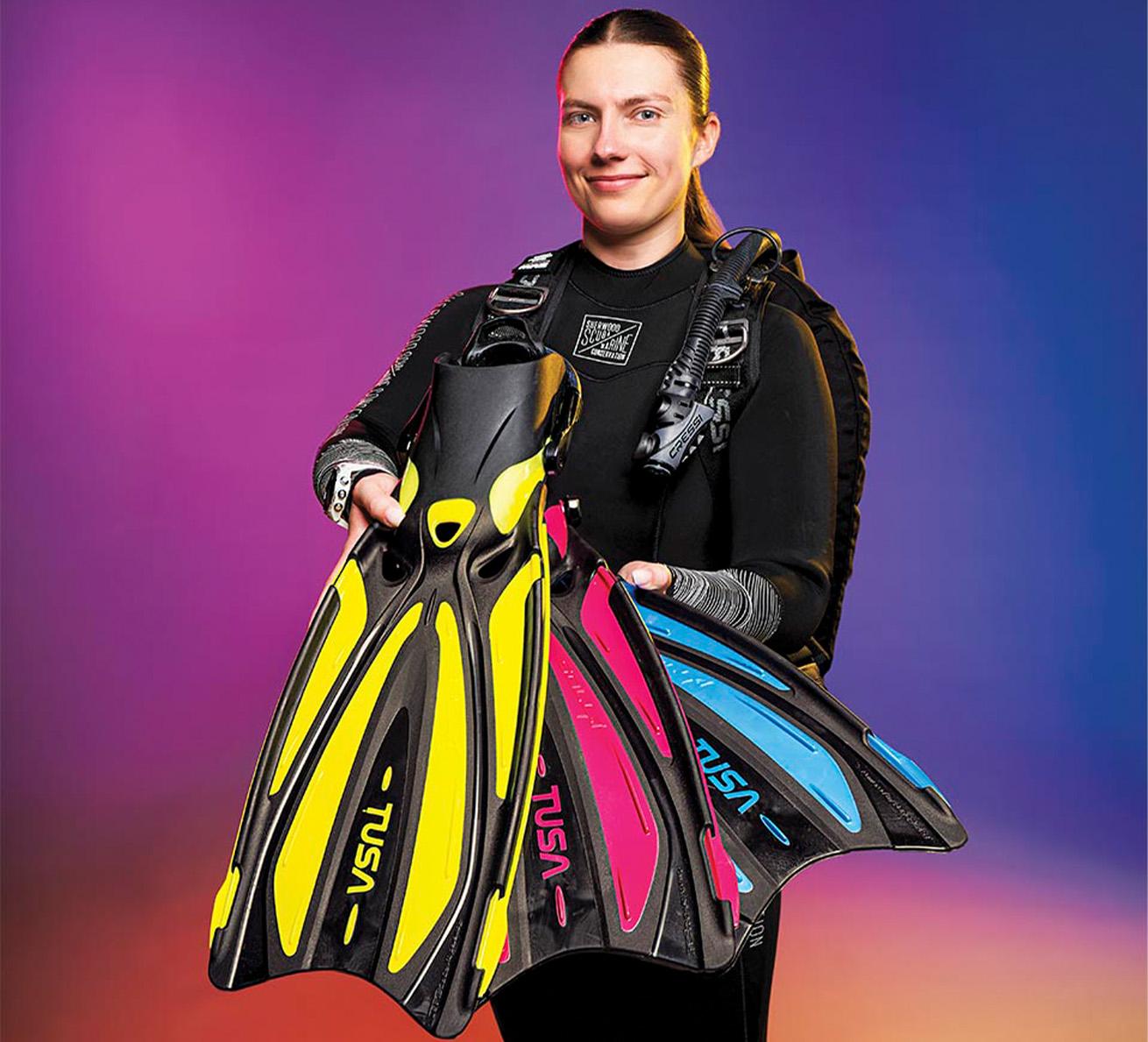 a diver holding out fins from best gear of the year