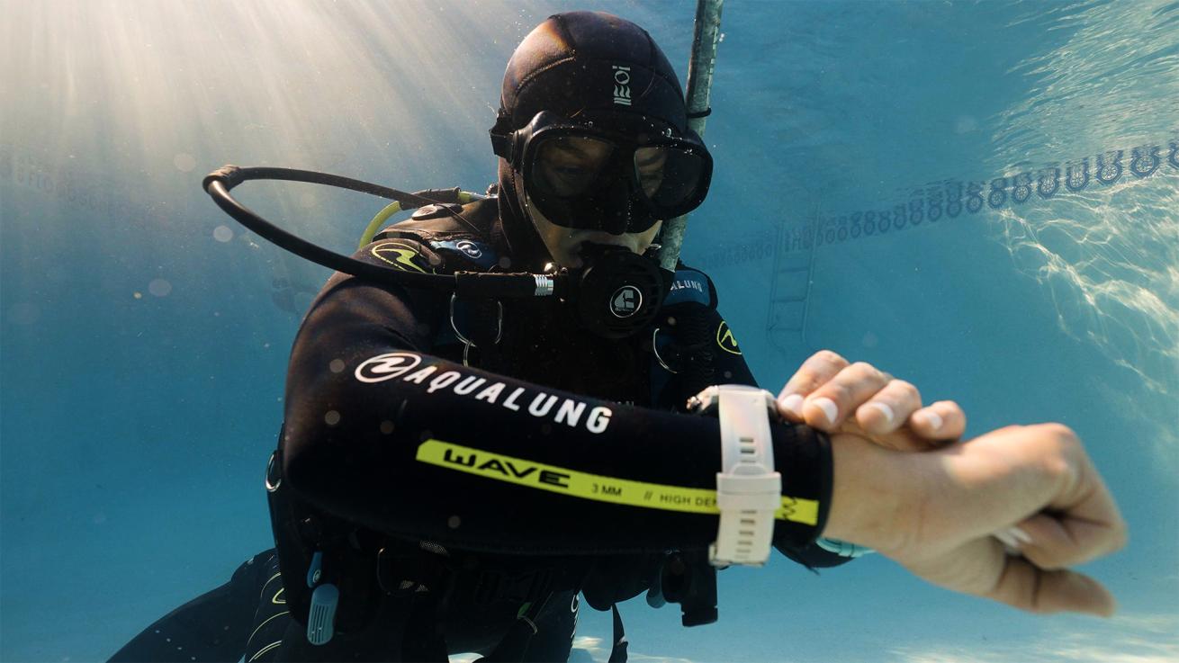 a diver looking at their dive computer